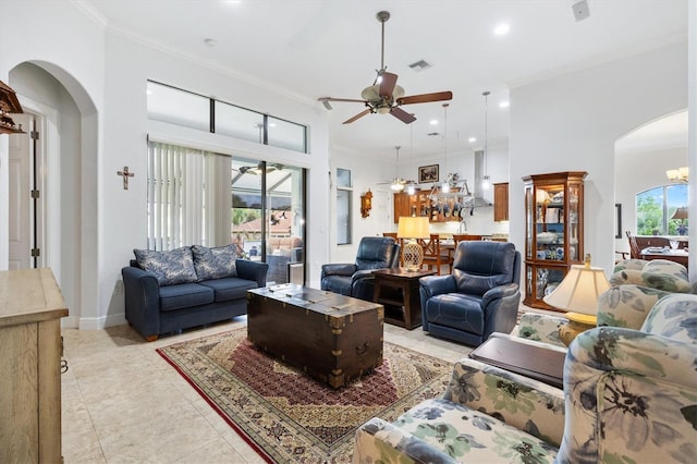 5233 Fountain Walk, Lady Lake, FL 32159 - living room featuring arched walkways, ornamental molding, ceiling fan, recessed lighting, and a chandelier
