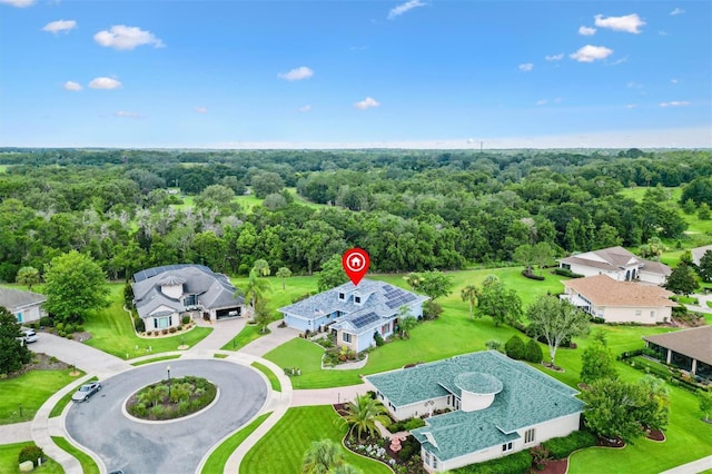 5233 Fountain Walk, Lady Lake, FL 32159 - aerial perspective of suburban area with a forest