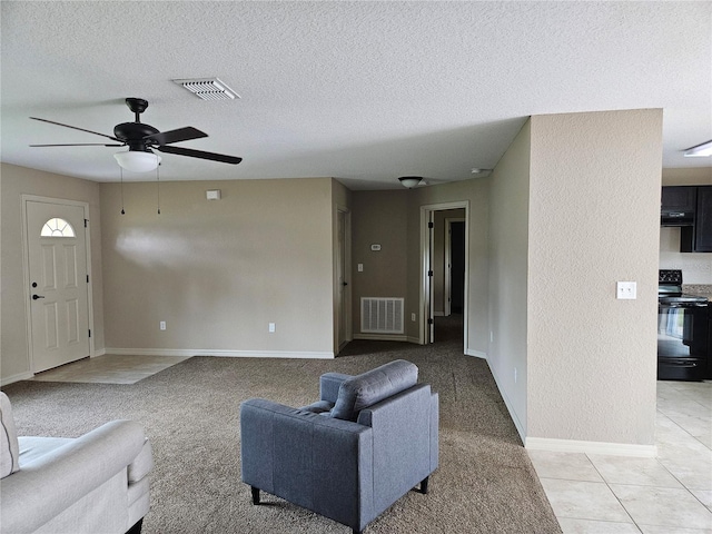 2494 SW 170th Loop, Ocala, FL 34473 - living area with a ceiling fan, a textured ceiling, and light carpet