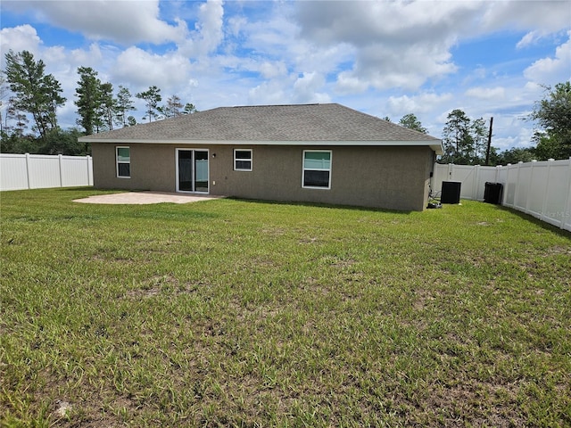 2494 SW 170th Loop, Ocala, FL 34473 - back of house with a patio, stucco siding, and a fenced backyard