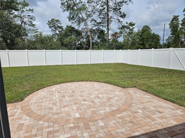 2494 SW 170th Loop, Ocala, FL 34473 - fenced backyard featuring a patio