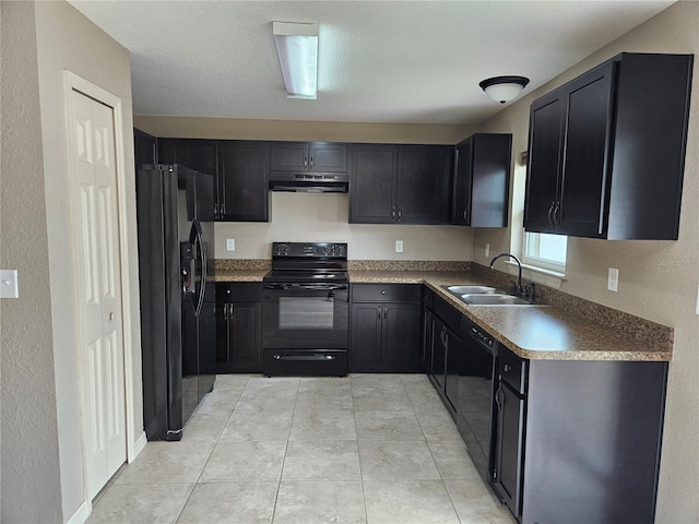 2494 SW 170th Loop, Ocala, FL 34473 - kitchen with black appliances, under cabinet range hood, dark cabinets, and a textured wall