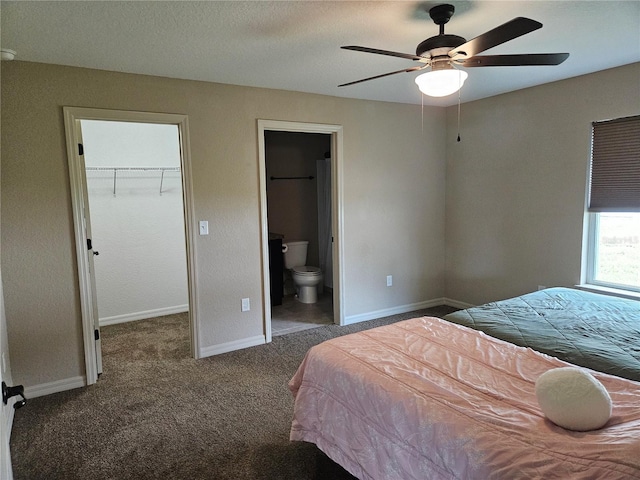 2494 SW 170th Loop, Ocala, FL 34473 - carpeted bedroom with a spacious closet, ensuite bath, a closet, and a ceiling fan