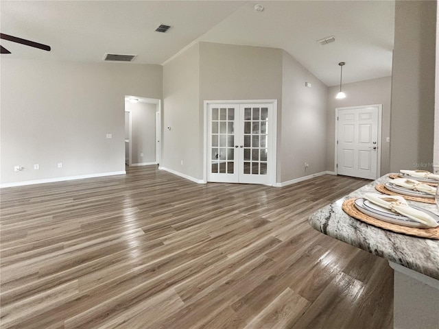 6431 SW 145th Lane Rd, Ocala, FL 34473 - unfurnished living room with lofted ceiling, ceiling fan, french doors, and wood finished floors