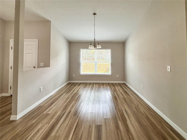 6431 SW 145th Lane Rd, Ocala, FL 34473 - unfurnished dining area with a chandelier and wood finished floors