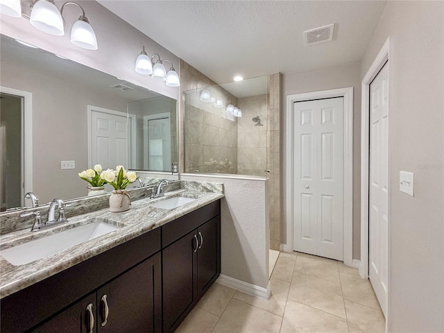 6431 SW 145th Lane Rd, Ocala, FL 34473 - bathroom with double vanity, a walk in shower, and tile patterned flooring