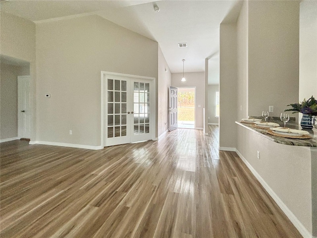 6431 SW 145th Lane Rd, Ocala, FL 34473 - spare room featuring french doors, wood finished floors, and high vaulted ceiling