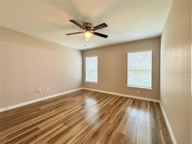 6431 SW 145th Lane Rd, Ocala, FL 34473 - spare room featuring wood finished floors and a ceiling fan