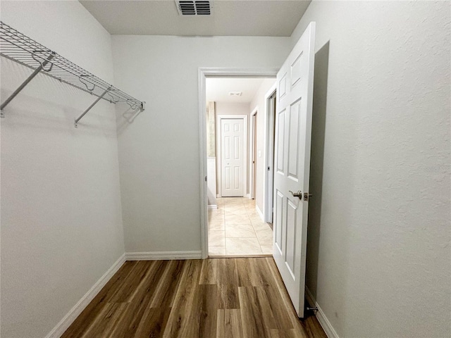 6431 SW 145th Lane Rd, Ocala, FL 34473 - walk in closet featuring wood finished floors
