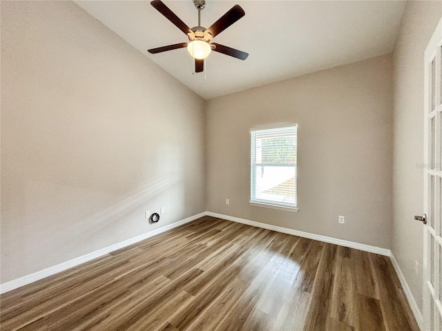 6431 SW 145th Lane Rd, Ocala, FL 34473 - spare room featuring vaulted ceiling, wood finished floors, and ceiling fan