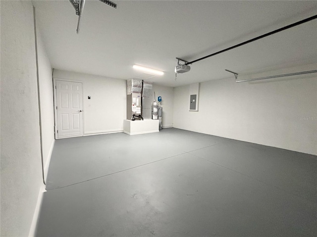 6431 SW 145th Lane Rd, Ocala, FL 34473 - garage featuring electric panel, heating unit, and a garage door opener