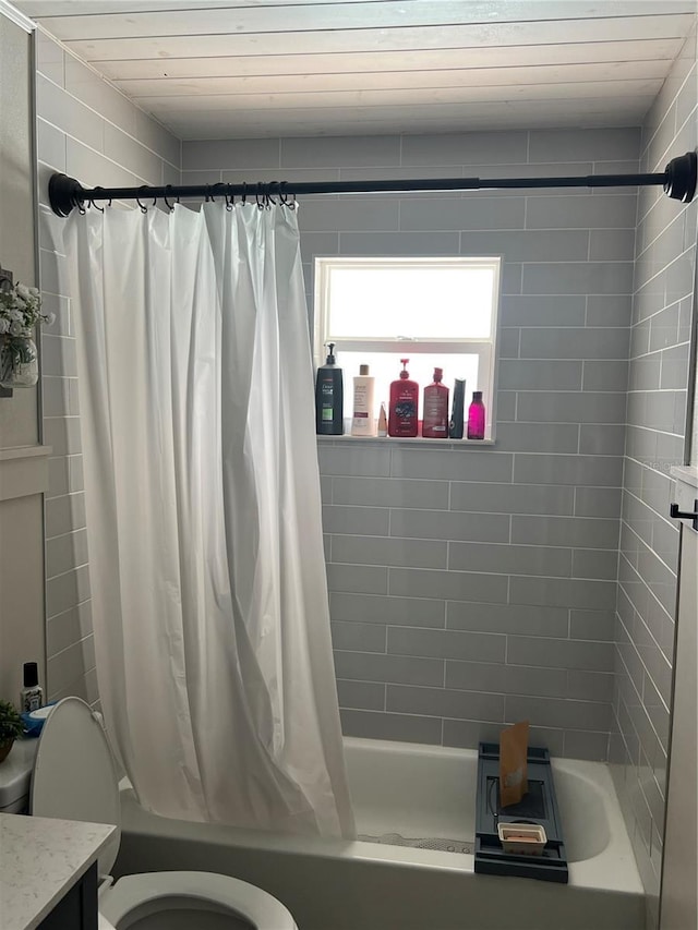 5561 NE 5th Pl, Ocala, FL 34470 - bathroom featuring shower / bathtub combination with curtain and vanity