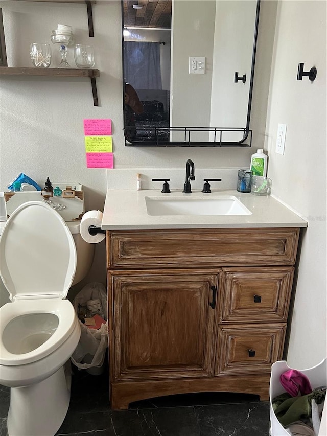 5561 NE 5th Pl, Ocala, FL 34470 - bathroom with vanity and toilet