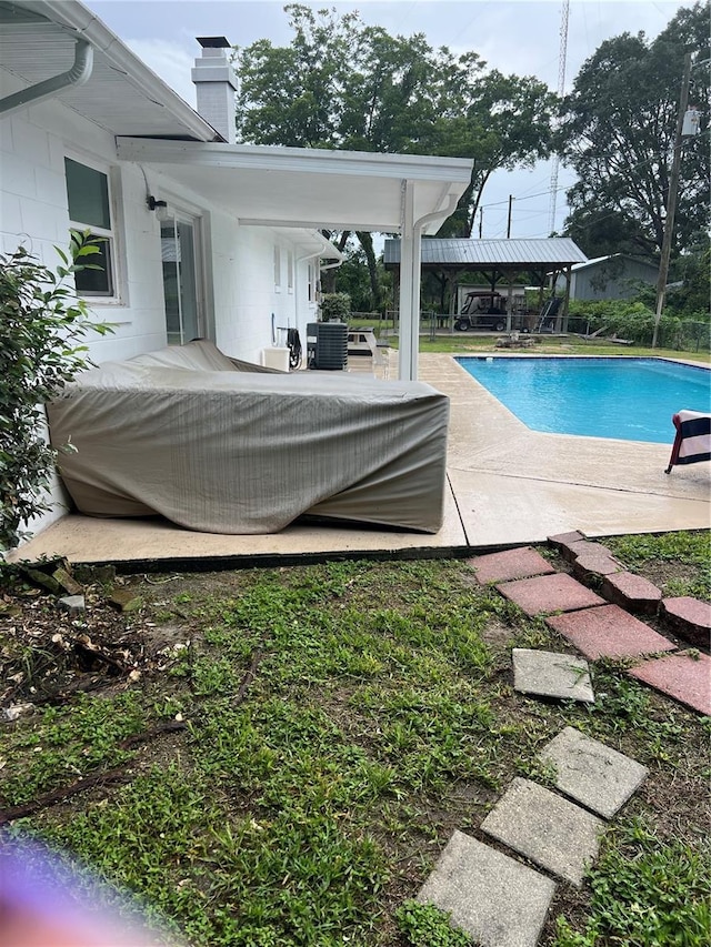 5561 NE 5th Pl, Ocala, FL 34470 - outdoor pool with a patio area and a gazebo
