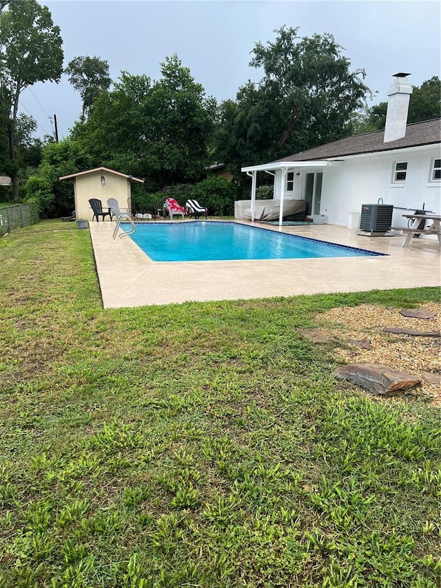 5561 NE 5th Pl, Ocala, FL 34470 - view of swimming pool with a patio area and a storage unit