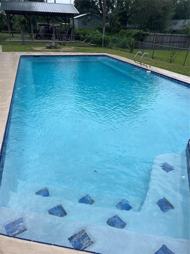 5561 NE 5th Pl, Ocala, FL 34470 - view of pool with a gazebo