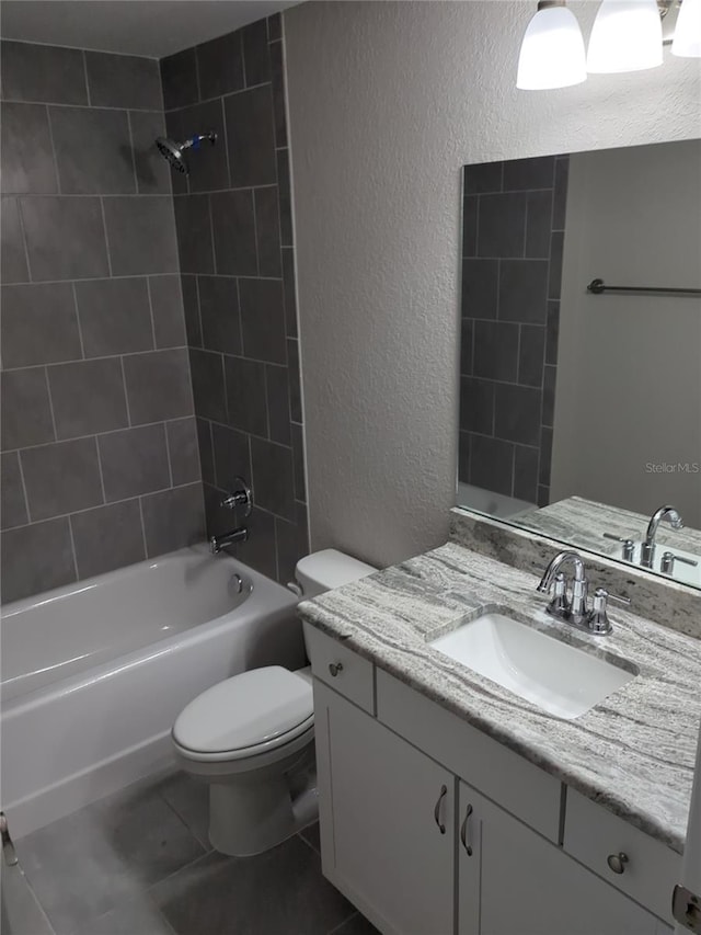 2869 SE 142nd Pl, Summerfield, FL 34491 - bathroom with a textured wall, vanity, shower / washtub combination, and tile patterned floors