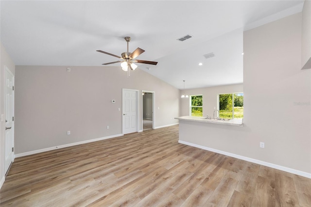 2869 SE 142nd Pl, Summerfield, FL 34491 - unfurnished living room featuring a ceiling fan, light wood finished floors, and lofted ceiling