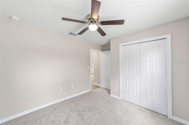 2869 SE 142nd Pl, Summerfield, FL 34491 - unfurnished bedroom with carpet, a closet, and a ceiling fan