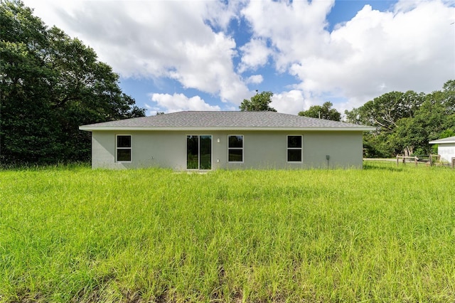 2869 SE 142nd Pl, Summerfield, FL 34491 - rear view of property featuring stucco siding
