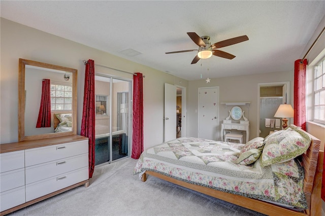 13006 Pebble Beach Cir, Hudson, FL 34667 - bedroom with carpet, access to exterior, and a ceiling fan