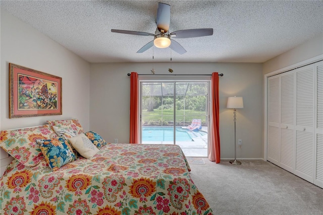 13006 Pebble Beach Cir, Hudson, FL 34667 - carpeted bedroom with access to exterior, ceiling fan, a textured ceiling, and a closet