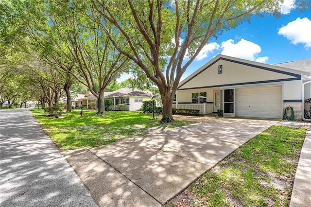 9664 SW 94th Ter Unit A, Ocala, FL 34481 - ranch-style home with a garage, concrete driveway, brick siding, a front yard, and stucco siding