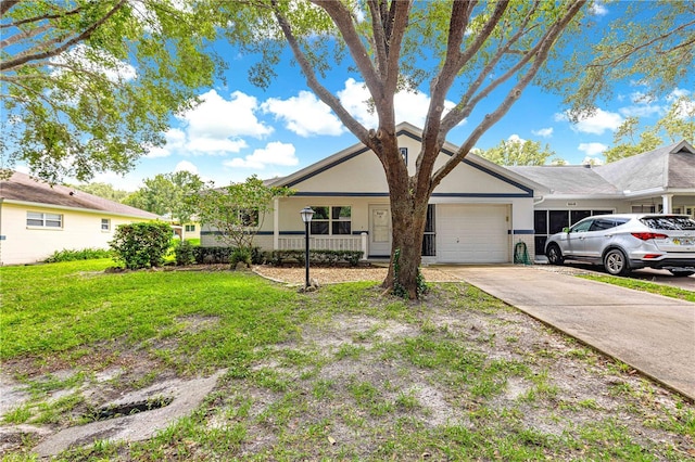 9664 SW 94th Ter Unit A, Ocala, FL 34481 - single story home featuring a garage, driveway, a front yard, and stucco siding