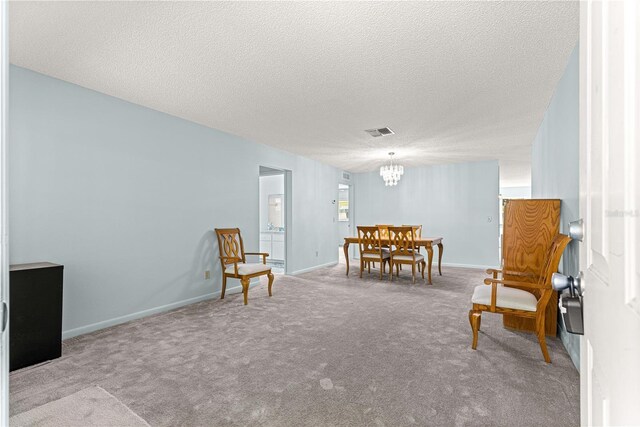 9664 SW 94th Ter Unit A, Ocala, FL 34481 - living area with a chandelier, carpet, and a textured ceiling