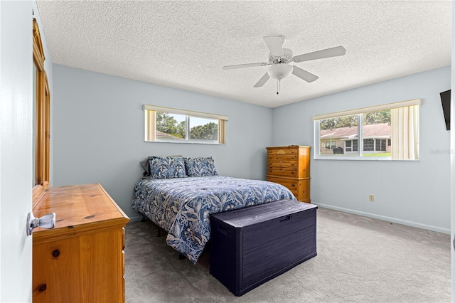9664 SW 94th Ter Unit A, Ocala, FL 34481 - bedroom with carpet, a textured ceiling, and a ceiling fan
