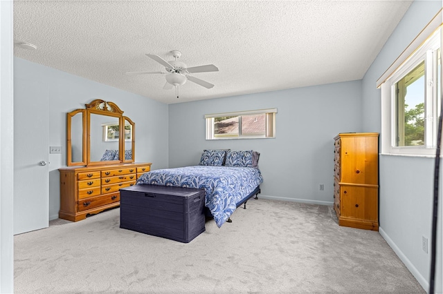 9664 SW 94th Ter Unit A, Ocala, FL 34481 - carpeted bedroom featuring a textured ceiling and a ceiling fan