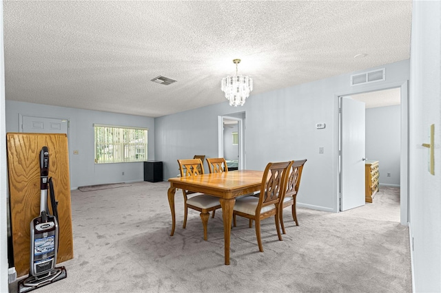 9664 SW 94th Ter Unit A, Ocala, FL 34481 - dining room featuring a chandelier, light carpet, and a textured ceiling