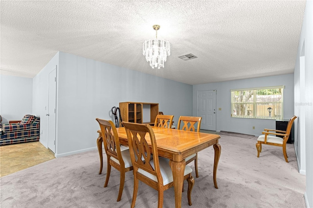 9664 SW 94th Ter Unit A, Ocala, FL 34481 - dining room featuring a chandelier, light colored carpet, and a textured ceiling