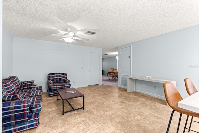 9664 SW 94th Ter Unit A, Ocala, FL 34481 - sitting room featuring a ceiling fan and a textured ceiling