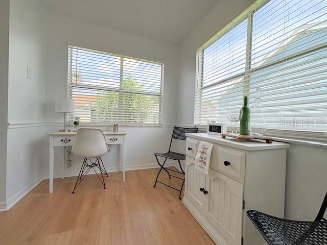528 Valencia Pl, Lady Lake, FL 32159 - home office featuring light wood-type flooring and baseboards