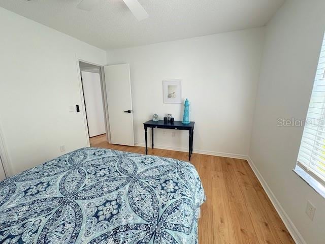 528 Valencia Pl, Lady Lake, FL 32159 - bedroom with light wood finished floors and a ceiling fan