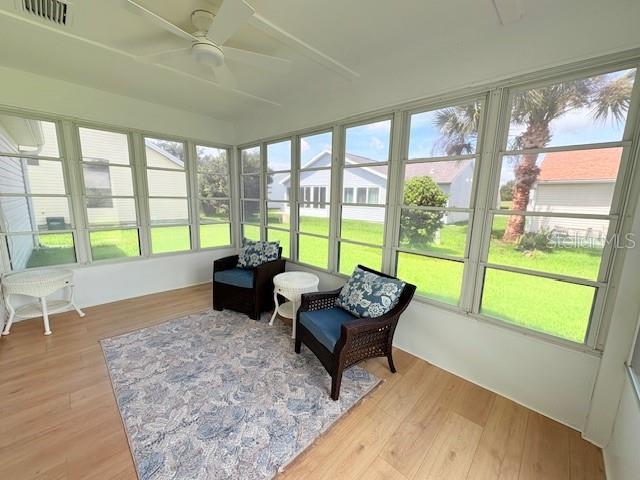 528 Valencia Pl, Lady Lake, FL 32159 - sunroom with a ceiling fan
