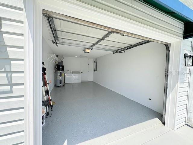 528 Valencia Pl, Lady Lake, FL 32159 - garage with washer and clothes dryer, a garage door opener, and heat pump water heater