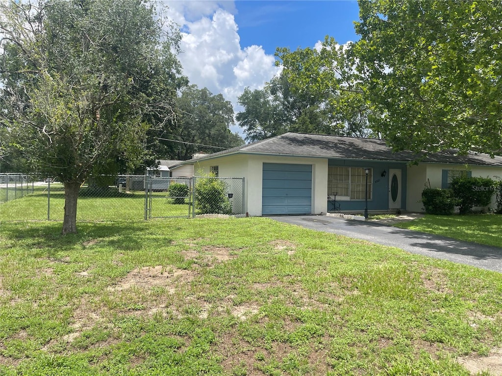 5501 SE 2nd Pl, Ocala, FL 34480 - view of front facade with stucco siding, driveway, and a garage
