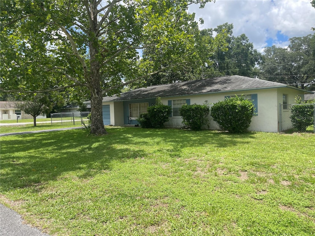 5501 SE 2nd Pl, Ocala, FL 34480 - view of front of home featuring stucco siding and an attached garage