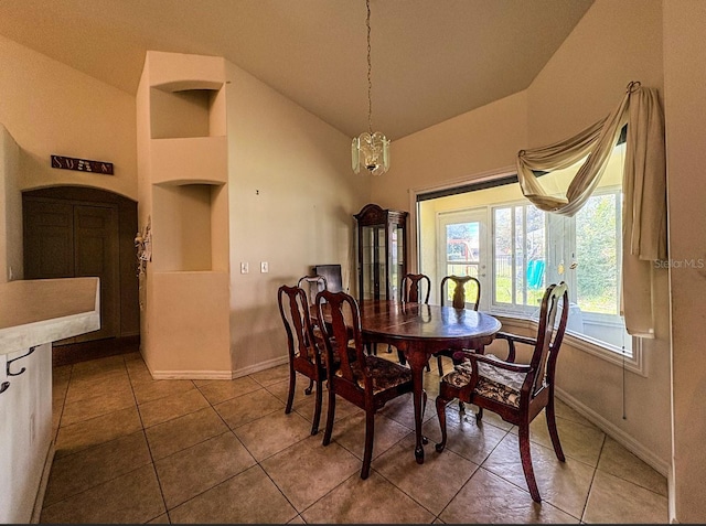8671 SW 57th Court Rd, Ocala, FL 34476 - dining space with lofted ceiling, tile patterned floors, and built in features
