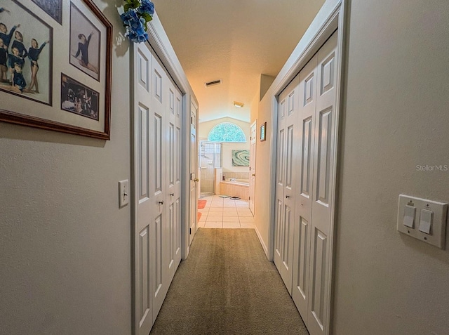8671 SW 57th Court Rd, Ocala, FL 34476 - corridor featuring carpet flooring and tile patterned flooring