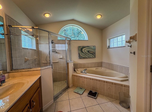 8671 SW 57th Court Rd, Ocala, FL 34476 - full bath featuring a garden tub, tile patterned floors, vanity, a shower stall, and vaulted ceiling