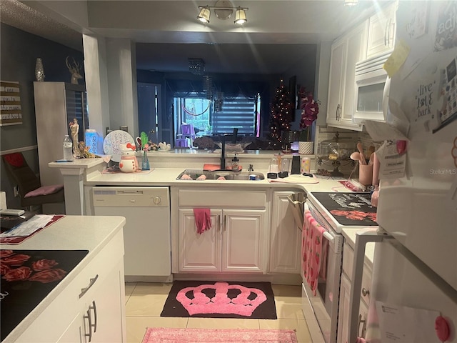 3106 S Semoran Blvd Unit 5, Orlando, FL 32822 - kitchen featuring white appliances, white cabinetry, light tile patterned floors, and light countertops