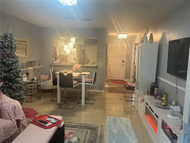 3106 S Semoran Blvd Unit 5, Orlando, FL 32822 - living area with light tile patterned floors and a textured ceiling