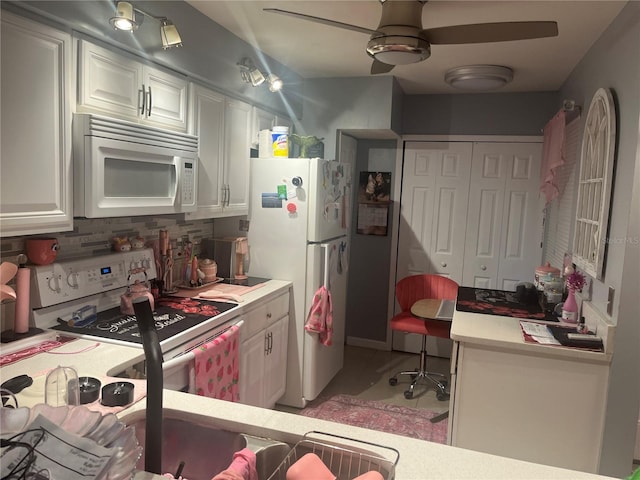 3106 S Semoran Blvd Unit 5, Orlando, FL 32822 - kitchen featuring white appliances, white cabinets, decorative backsplash, light countertops, and ceiling fan