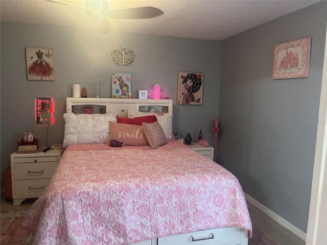 3106 S Semoran Blvd Unit 5, Orlando, FL 32822 - bedroom featuring a textured ceiling and a ceiling fan