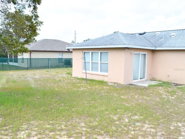 254 Marion Oaks Mnr, Ocala, FL 34473 - rear view of house with stucco siding and a shingled roof