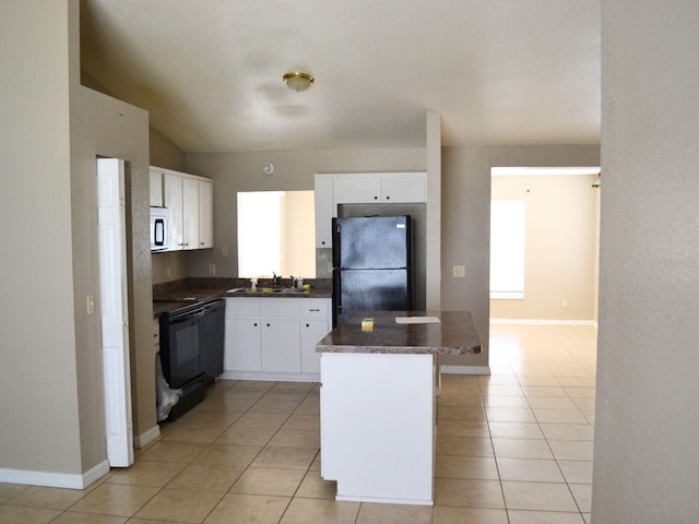254 Marion Oaks Mnr, Ocala, FL 34473 - kitchen with freestanding refrigerator, white microwave, dark countertops, light tile patterned flooring, and lofted ceiling