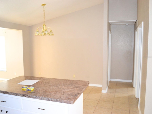 254 Marion Oaks Mnr, Ocala, FL 34473 - kitchen with a chandelier, white cabinetry, light tile patterned flooring, hanging light fixtures, and light countertops